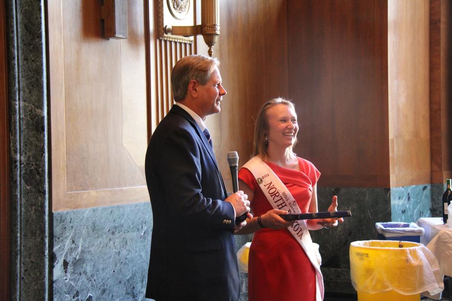 ND Cherry Blossom Princess-April 2012- Senator Hoeven thanks 2012 North Dakota Cherry Blossom Princess Ingrid King of Fargo for representing the state at the annual Cherry Blossom Festival in Washington, DC and presents her with a gift for her service.