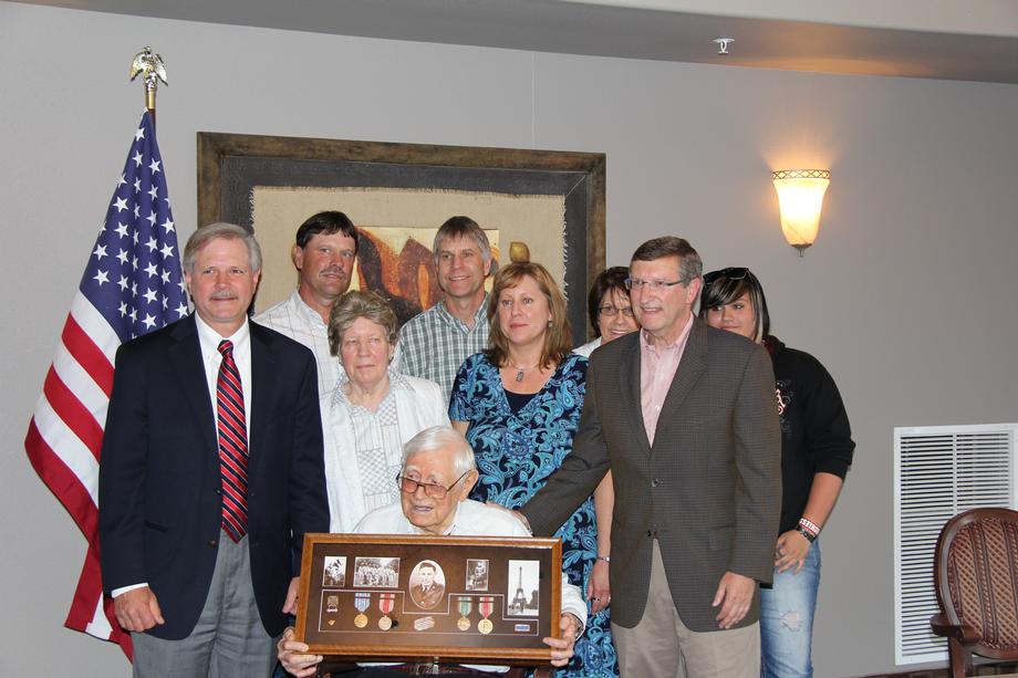 WWII Medal Presentation Ceremony-July, 2012- Senators Hoeven and Kent Conrad present military honors to North Dakota native Pvt. First Class Kenneth Johnston who served in the United States Army during World War II. Johnston’s military decorations had been stored in his parents’ Sanish, North Dakota home but were misplaced following their deaths in 1957. Pvt. Johnston’s family worked with Sen. Conrad to secure duplicates of the medals and with Sen. Hoeven to hold a ceremony to present and honor Pvt. Johnston with these medals.