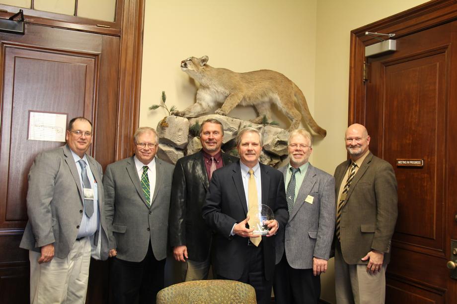 North Dakota Grain Growers-January 2014- Senator Hoeven meets with the North Dakota Grain Growers and accepts their Wheat Award for his work to support agriculture. 