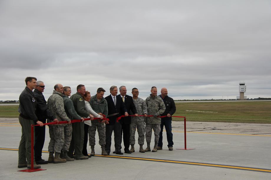 Minot AFB Ribbon Cutting Ceremony-September 2014 - Senator Hoeven, who worked through his position on the Senate Appropriations Committee to fund major renovations on the Minot Air Force Base, joins Air Force leaders, civilian employees and other dignitaries to celebrate the completion of the base’s new $57 million runway project.
